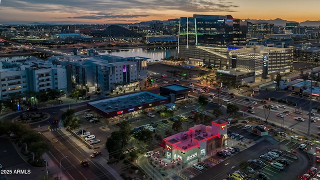 aerial view at dusk featuring a view of city