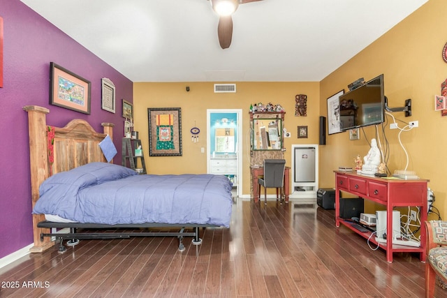 bedroom featuring dark wood-style floors, ceiling fan, visible vents, and baseboards