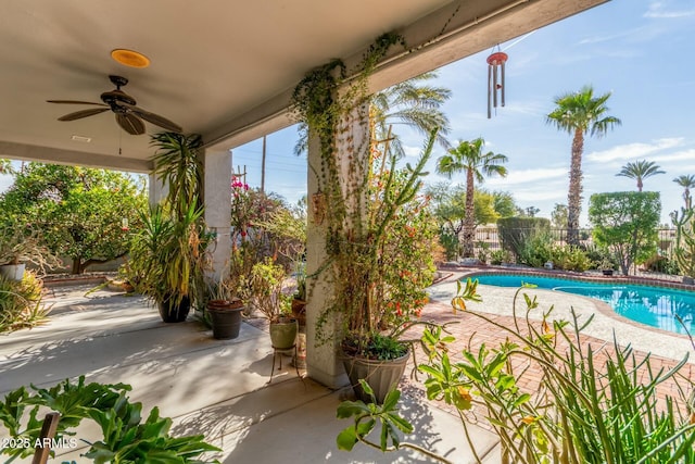 view of pool with a fenced in pool, a fenced backyard, ceiling fan, and a patio