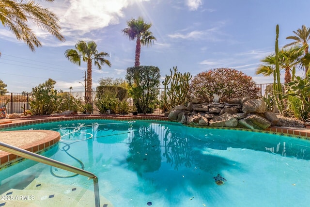 view of pool featuring fence and a fenced in pool