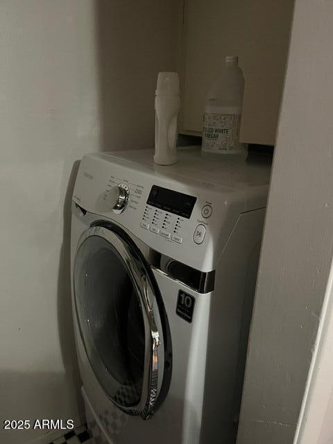 clothes washing area featuring washer / clothes dryer