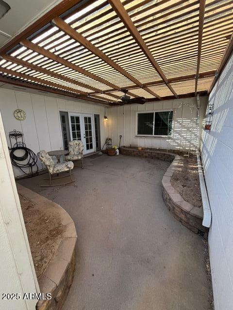 view of patio with a pergola and french doors