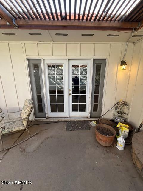 doorway to property featuring french doors and a patio