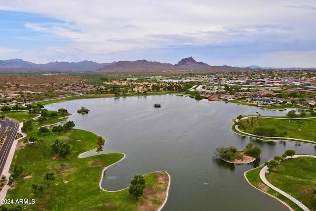 drone / aerial view featuring a water and mountain view