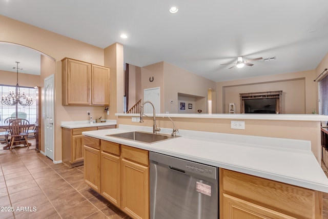 kitchen featuring light brown cabinets, ceiling fan with notable chandelier, a sink, light countertops, and dishwasher