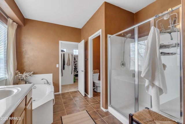 full bath with a bath, a healthy amount of sunlight, a stall shower, and tile patterned flooring