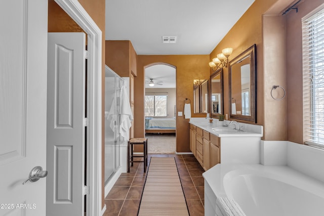 full bath featuring visible vents, ensuite bath, double vanity, a sink, and tile patterned floors