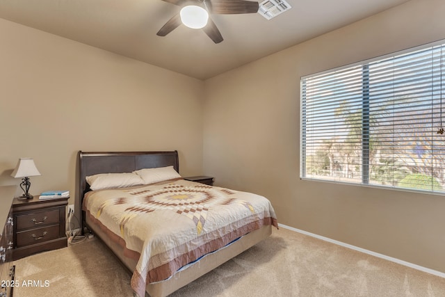 bedroom with ceiling fan, carpet, visible vents, and baseboards