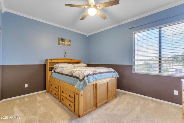 bedroom with baseboards, light carpet, ceiling fan, and crown molding