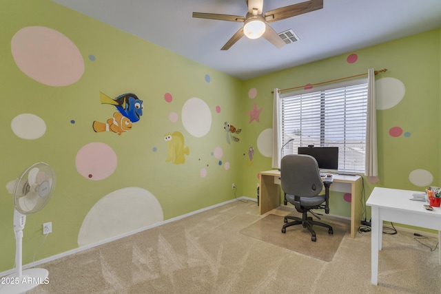 unfurnished office featuring baseboards, visible vents, a ceiling fan, and carpet