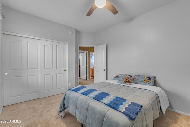 bedroom featuring ceiling fan, carpet, a closet, and baseboards