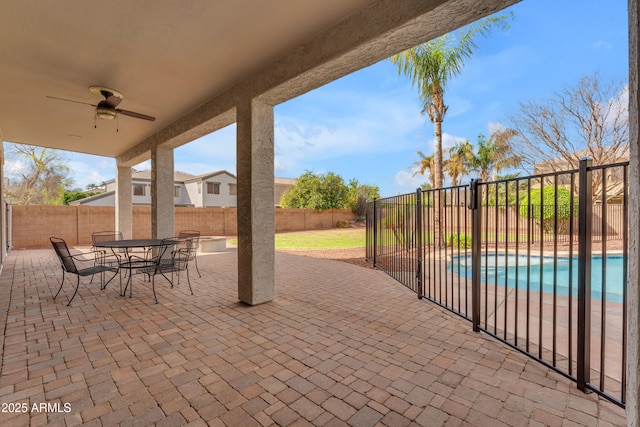 view of patio / terrace featuring ceiling fan, a fenced in pool, and a fenced backyard