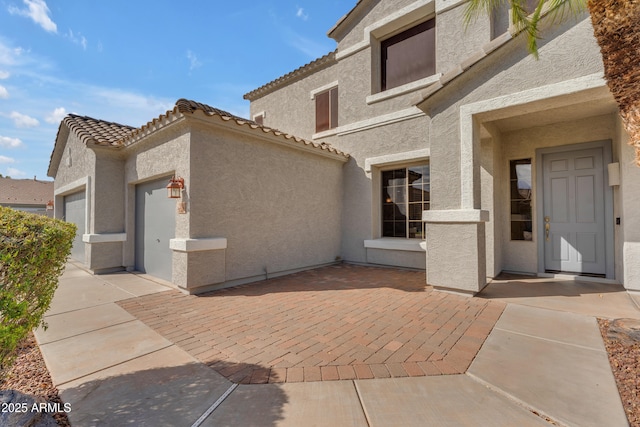 view of patio / terrace with a garage