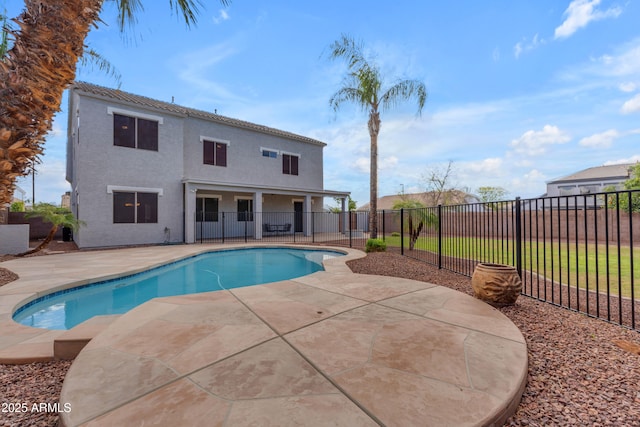 view of swimming pool with a fenced in pool, a patio, and a fenced backyard