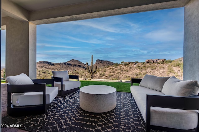 view of patio / terrace with a mountain view and an outdoor hangout area