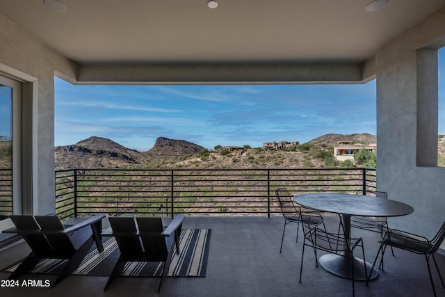 balcony featuring a mountain view