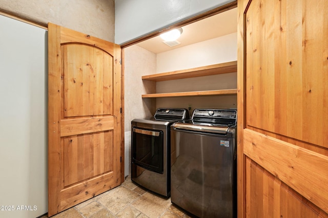 laundry room with separate washer and dryer