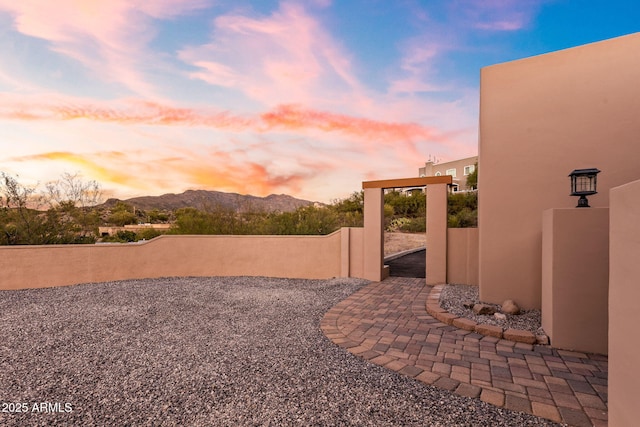 yard at dusk with a mountain view