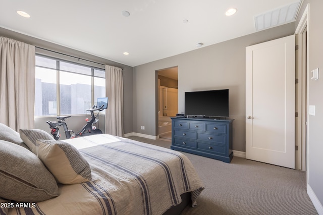 carpeted bedroom featuring a mountain view and ensuite bath