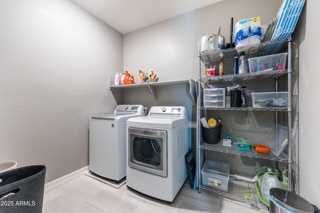 clothes washing area with independent washer and dryer