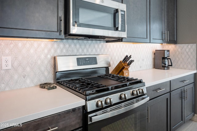 kitchen featuring backsplash and stainless steel appliances