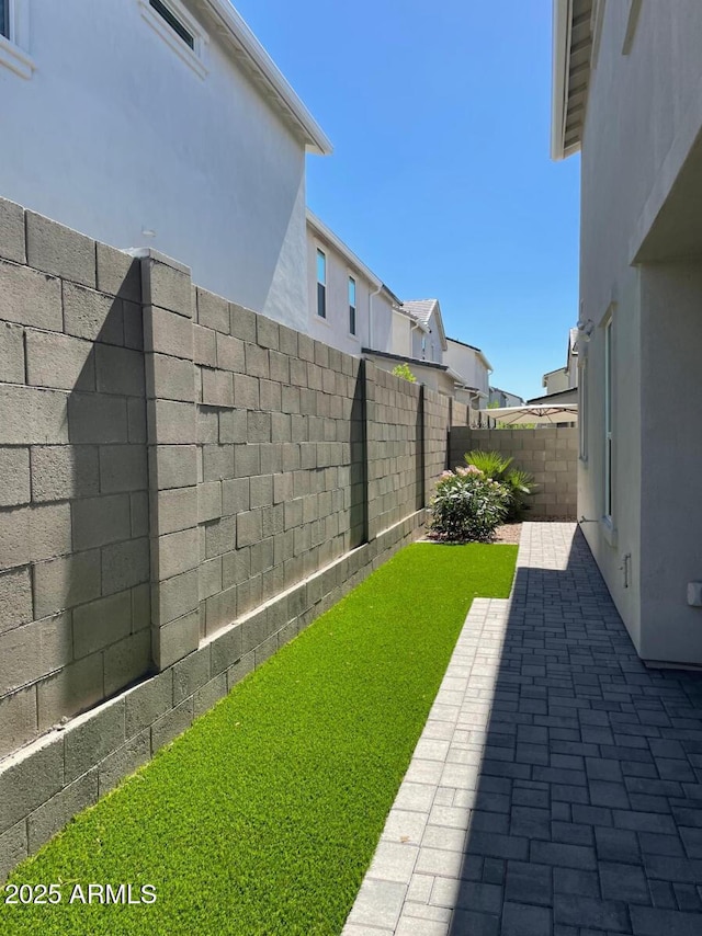 view of yard with a patio area and a fenced backyard