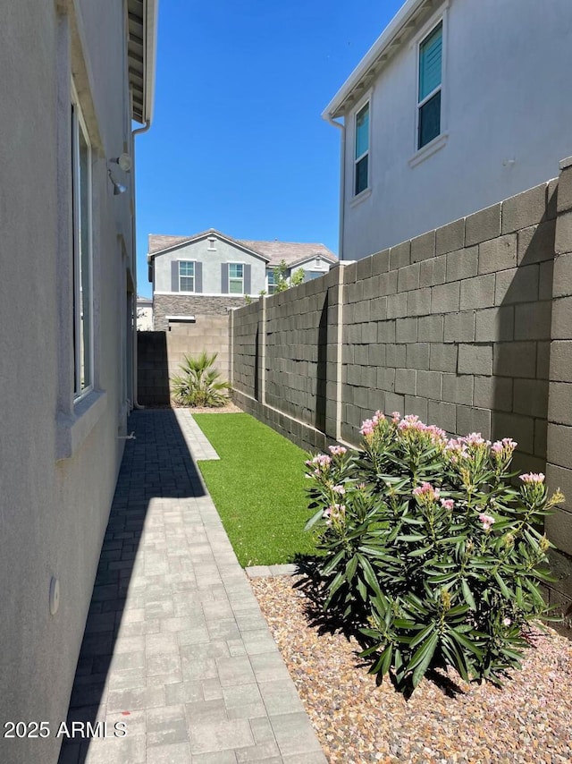 view of yard featuring a patio and a fenced backyard