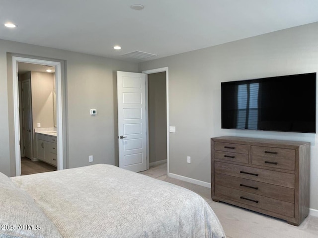 bedroom featuring visible vents, baseboards, light colored carpet, recessed lighting, and ensuite bathroom