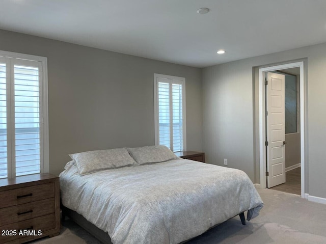 bedroom with recessed lighting, baseboards, and light colored carpet