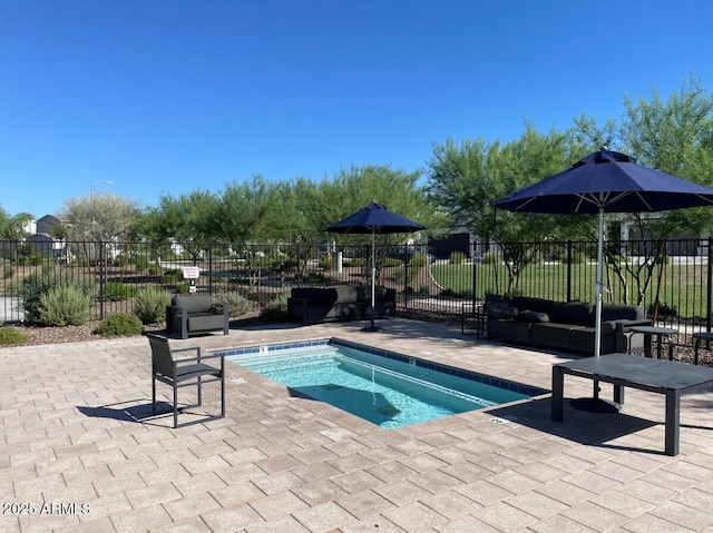 view of pool with a patio area, an outdoor hangout area, and fence