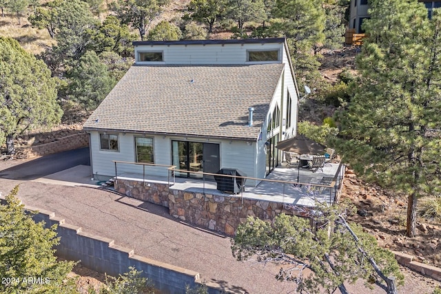 back of property featuring a patio area