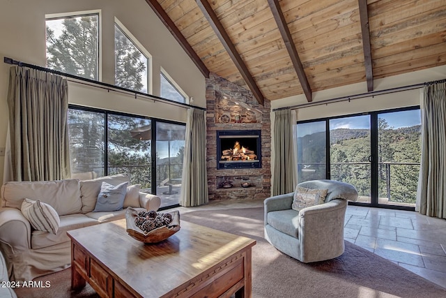 carpeted living room featuring beam ceiling, plenty of natural light, and high vaulted ceiling