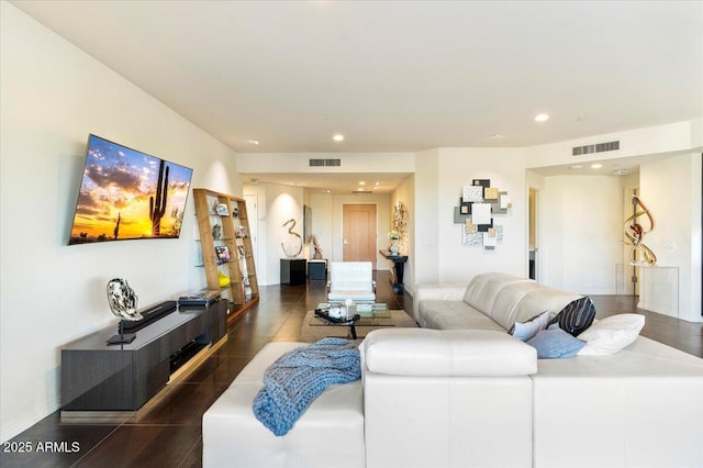 living room with visible vents, recessed lighting, and baseboards