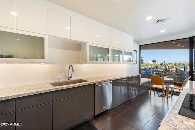 kitchen with visible vents, glass insert cabinets, dishwasher, white cabinetry, and a sink