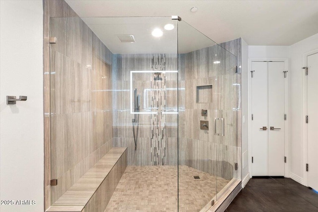 bathroom featuring tile patterned floors, a sauna, and a stall shower