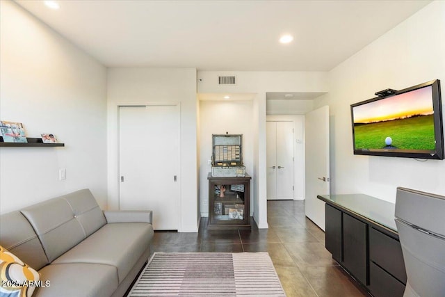 living area featuring recessed lighting and visible vents