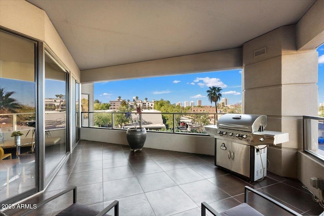 balcony with visible vents, a view of city, and a grill