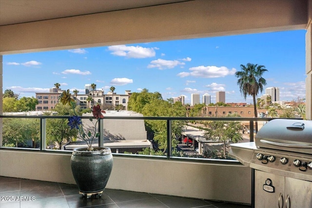 balcony featuring a city view and grilling area