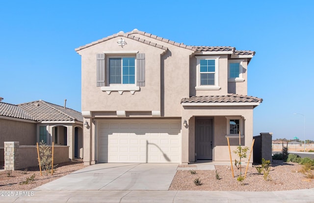 mediterranean / spanish-style home featuring a garage