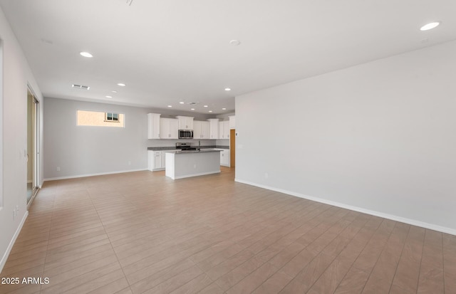 unfurnished living room with light hardwood / wood-style floors