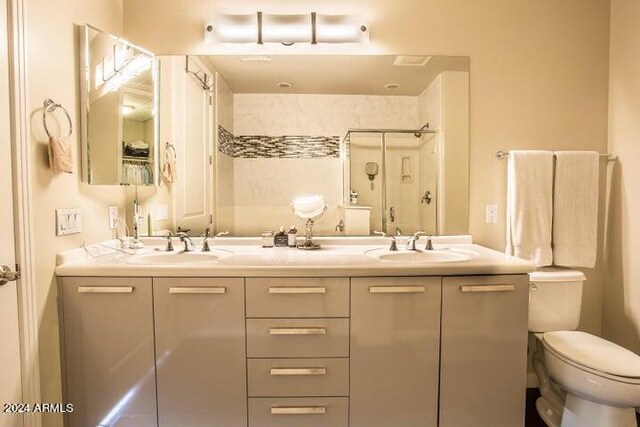 1 E Lexington Ave Unit 410, Phoenix, AZ 85012 - full bathroom with double vanity, a stall shower, and toilet