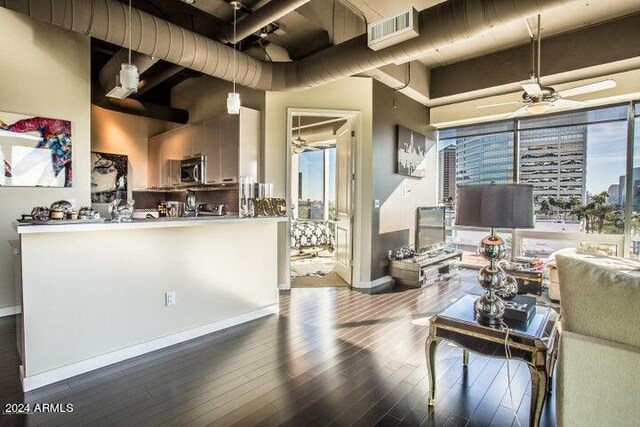 1 E Lexington Ave Unit 410, Phoenix, AZ 85012 - living room with a ceiling fan, wood finished floors, and baseboards