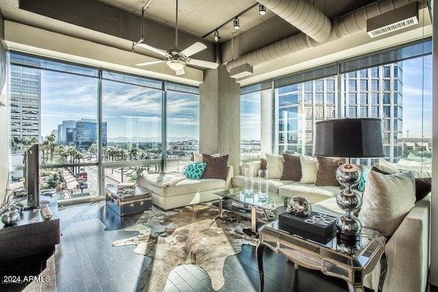 sunroom featuring ceiling fan