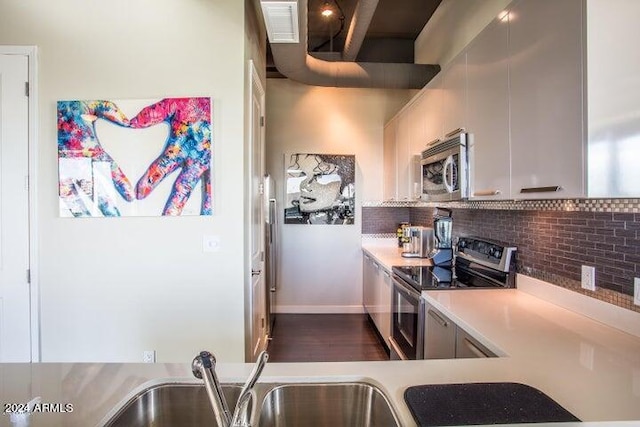 kitchen featuring backsplash and stainless steel appliances