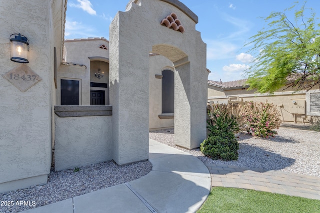 doorway to property with stucco siding