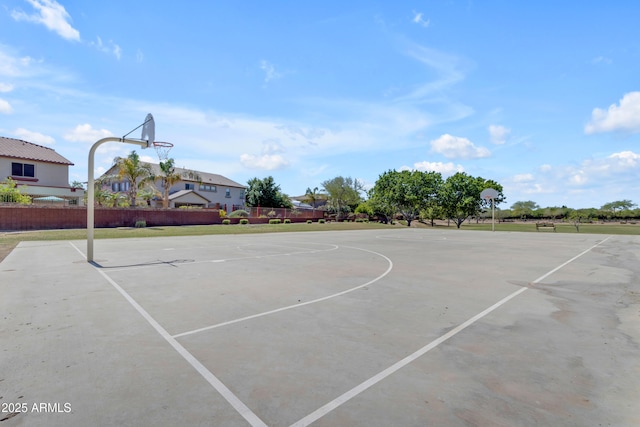 view of basketball court featuring community basketball court and fence