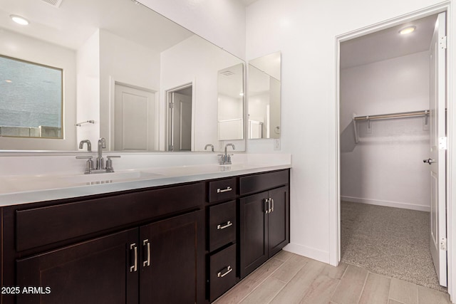 bathroom with vanity and wood-type flooring