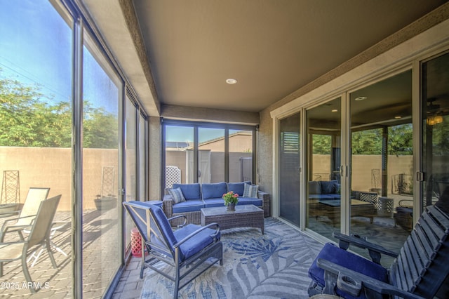 sunroom / solarium featuring an outdoor living space