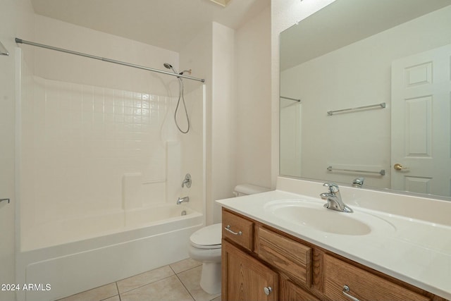 full bathroom featuring tile patterned flooring, vanity, bathing tub / shower combination, and toilet