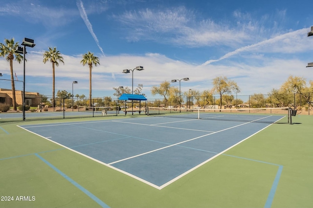 view of sport court featuring basketball hoop